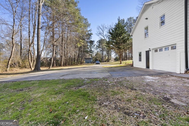 view of yard featuring a garage