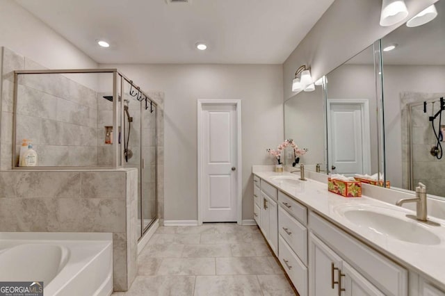 bathroom featuring tile patterned flooring, vanity, and separate shower and tub