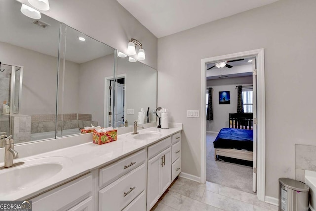 bathroom featuring tile patterned floors, vanity, and ceiling fan