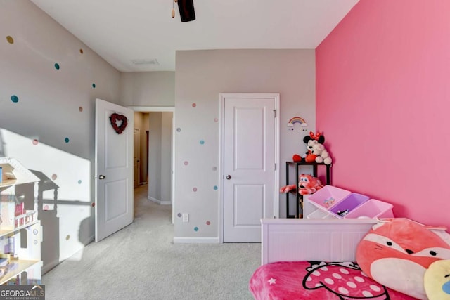 bedroom featuring light colored carpet