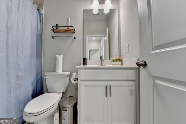 bathroom with vanity and toilet