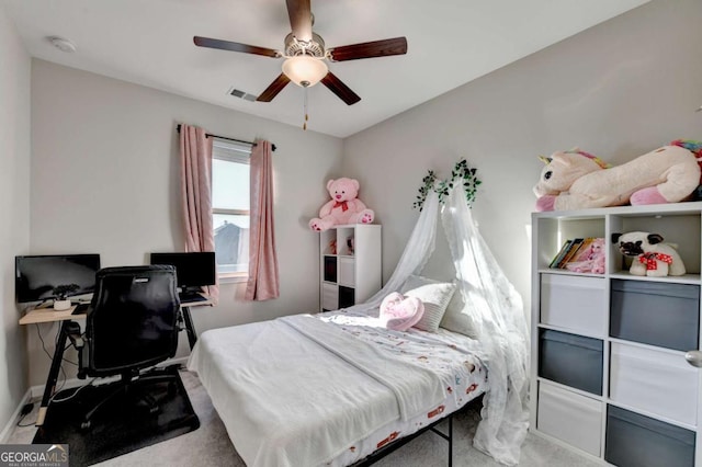 bedroom featuring ceiling fan and light carpet