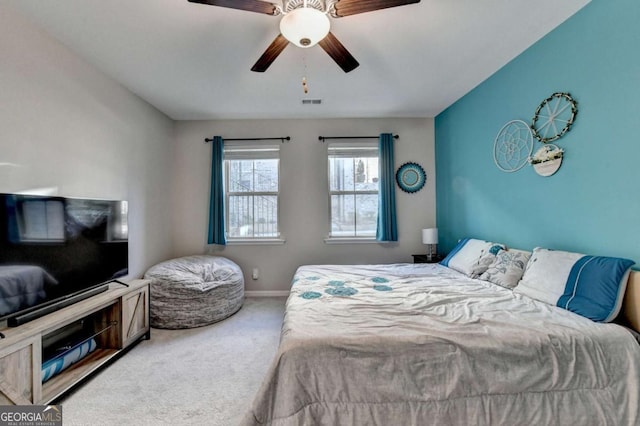 carpeted bedroom featuring ceiling fan