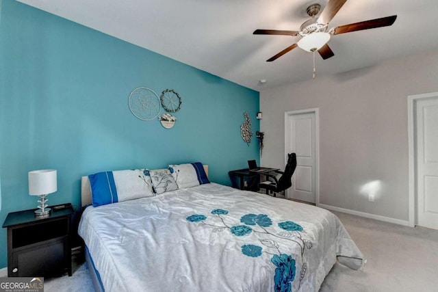 bedroom featuring ceiling fan and light carpet