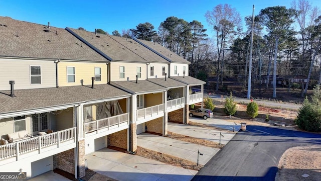 back of property featuring a balcony