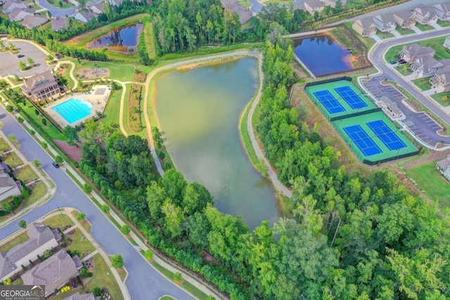 birds eye view of property with a water view