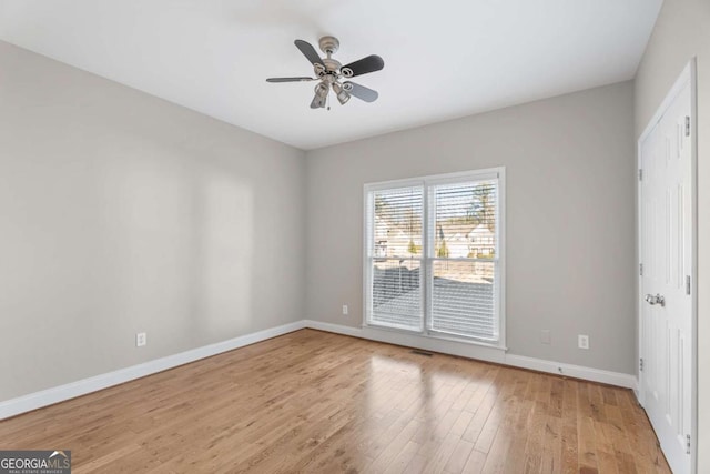 spare room with ceiling fan and light hardwood / wood-style floors