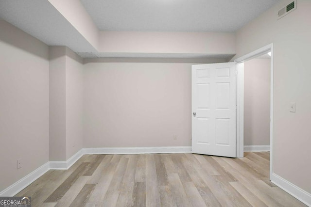 basement with light wood-type flooring