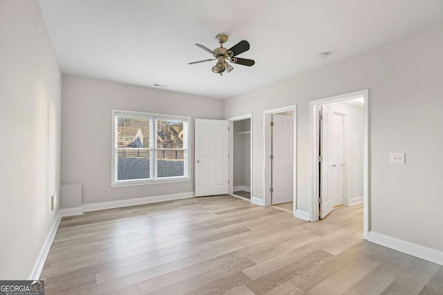 unfurnished bedroom with light hardwood / wood-style flooring and ceiling fan