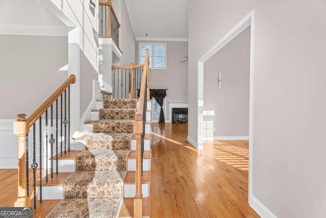 interior space with crown molding and light wood-type flooring