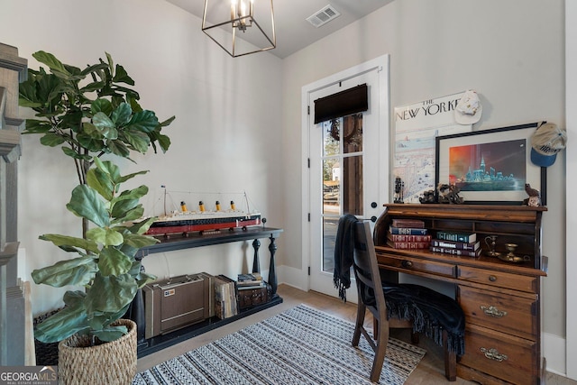 office area featuring a notable chandelier