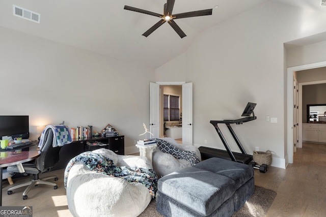 interior space featuring ceiling fan, hardwood / wood-style floors, and high vaulted ceiling