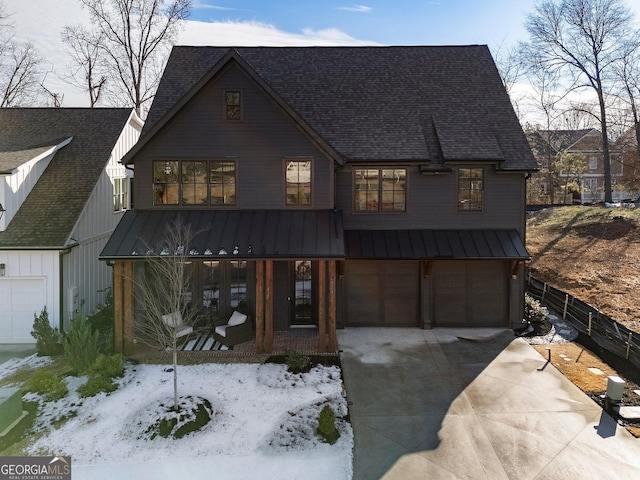 view of front facade featuring a garage and a porch