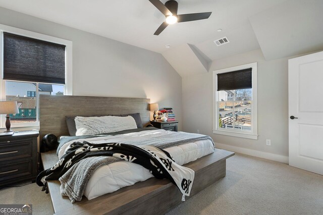 bedroom with light carpet, ceiling fan, and lofted ceiling