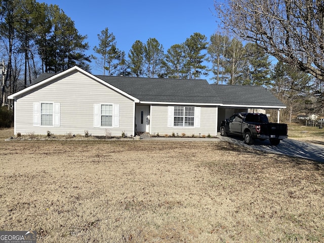 single story home with a carport