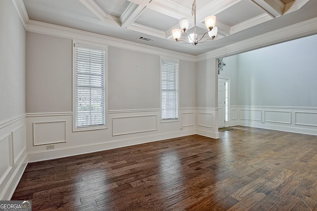 empty room with beam ceiling, dark wood-type flooring, coffered ceiling, an inviting chandelier, and ornamental molding