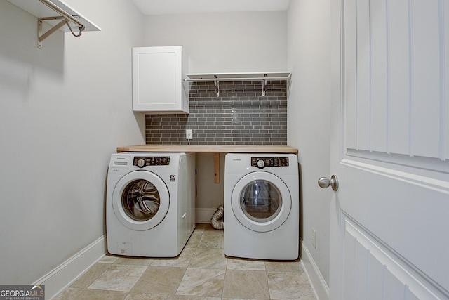 laundry room featuring cabinets and independent washer and dryer