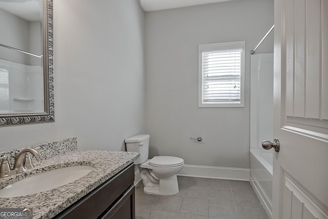 full bathroom featuring tile patterned floors, vanity, toilet, and shower / washtub combination