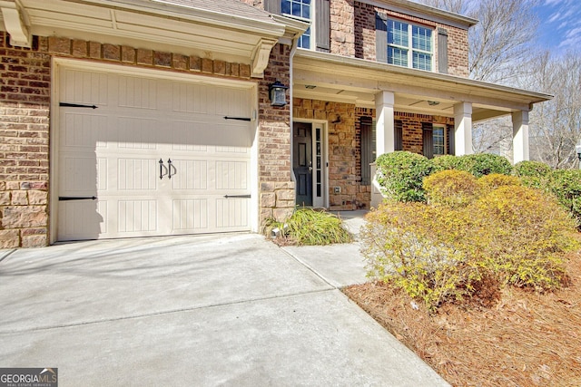 property entrance with covered porch and a garage