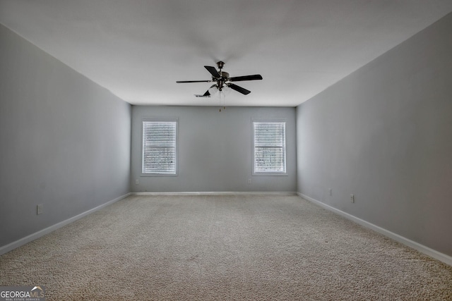 carpeted empty room with ceiling fan