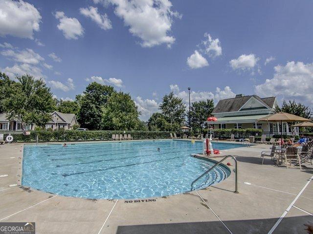 view of swimming pool featuring a patio