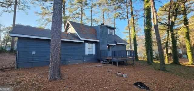 rear view of house with a wooden deck