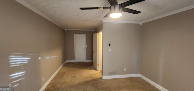 corridor featuring light carpet, a textured ceiling, and ornamental molding