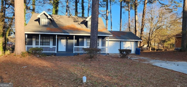 view of front of property with a porch and a garage