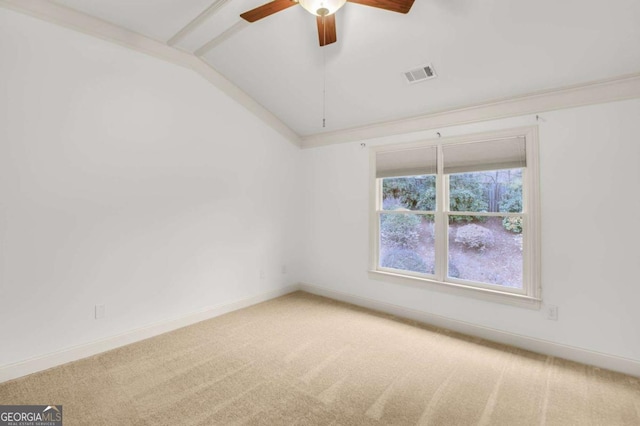 carpeted spare room with ceiling fan and lofted ceiling