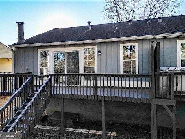 rear view of house with a wooden deck