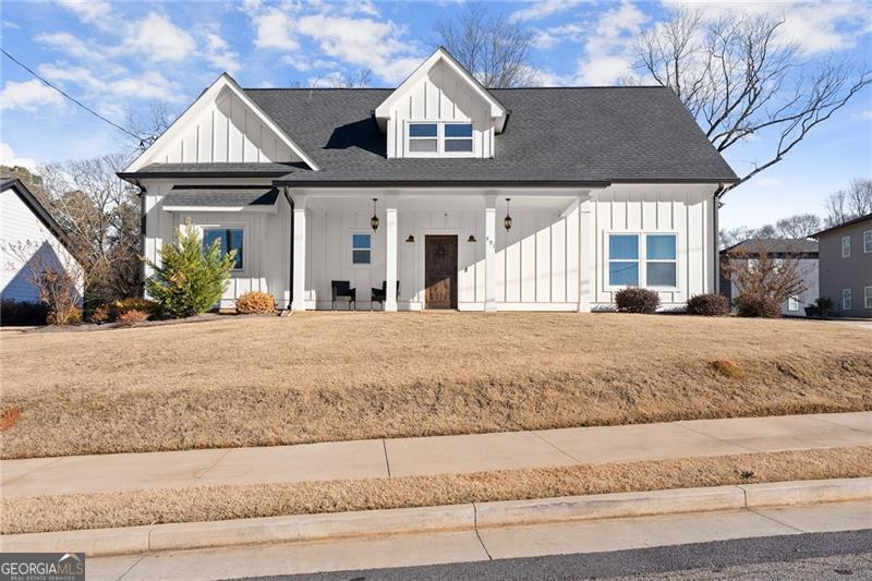 modern farmhouse with a front yard