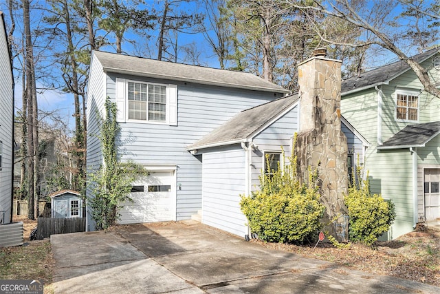 exterior space with a garage and central air condition unit