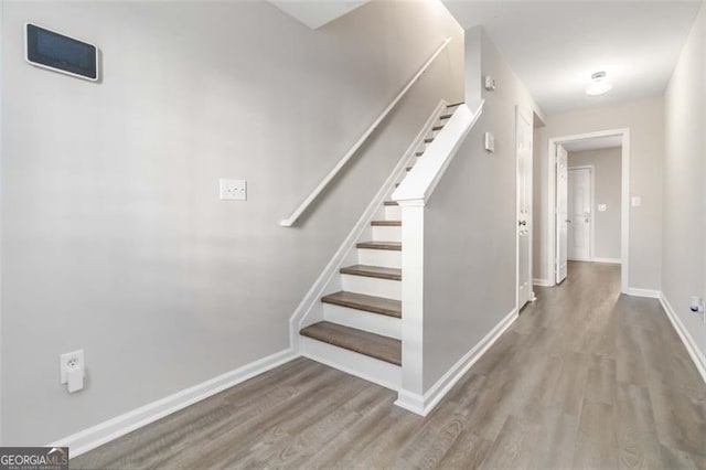 stairway with wood-type flooring