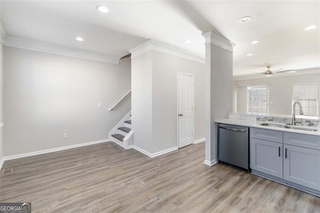 kitchen featuring dishwasher, sink, light hardwood / wood-style flooring, ceiling fan, and ornamental molding