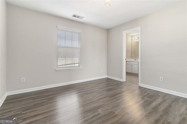 empty room featuring dark hardwood / wood-style floors