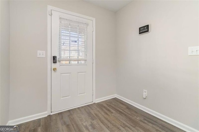 doorway to outside with dark hardwood / wood-style flooring