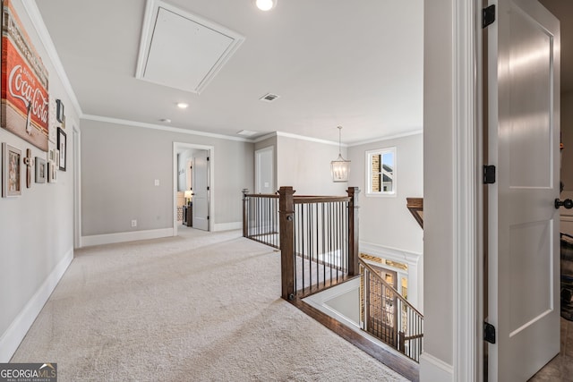 hall with crown molding and carpet