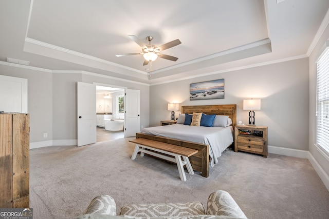 carpeted bedroom featuring a raised ceiling, ceiling fan, and ornamental molding