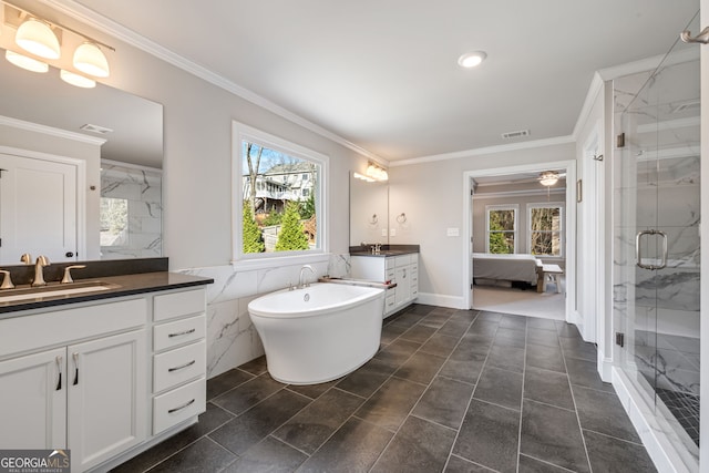 bathroom featuring tile walls, ornamental molding, separate shower and tub, and vanity