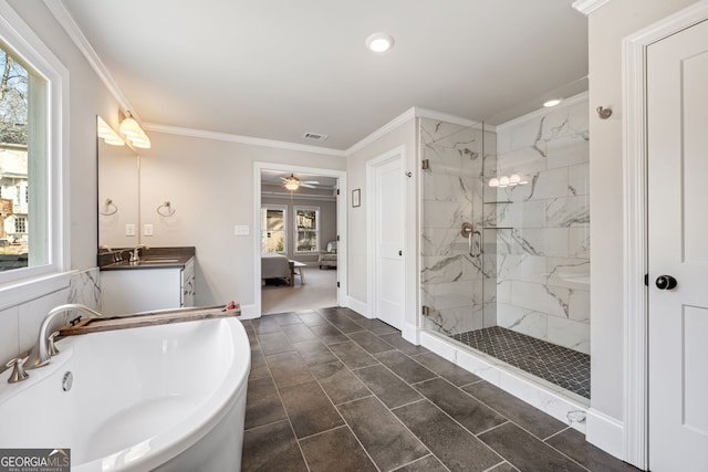 bathroom featuring ceiling fan, separate shower and tub, ornamental molding, and a wealth of natural light