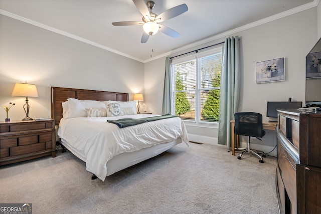 bedroom featuring ceiling fan, light colored carpet, and crown molding