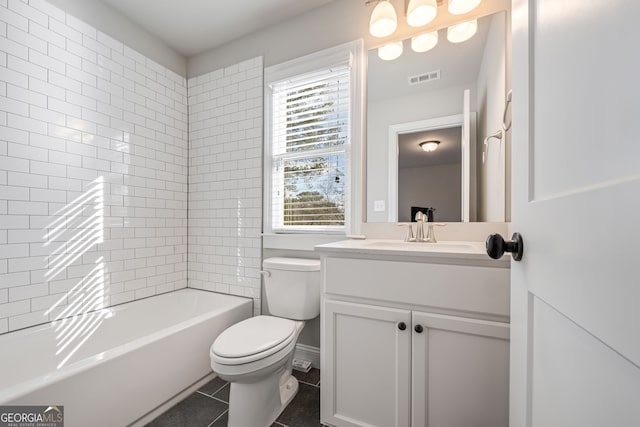 full bathroom featuring toilet, tile patterned flooring, vanity, and plenty of natural light