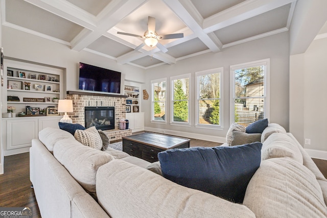 living room with a wealth of natural light, built in shelves, and a fireplace