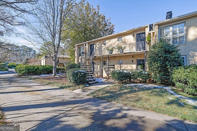 view of front of home with a balcony