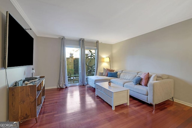 living room with dark hardwood / wood-style floors and crown molding