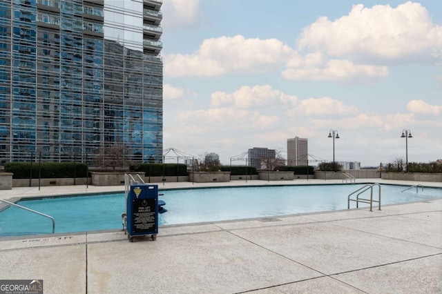 view of swimming pool featuring a patio