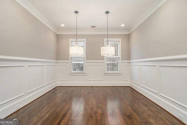 unfurnished dining area with crown molding and dark wood-type flooring