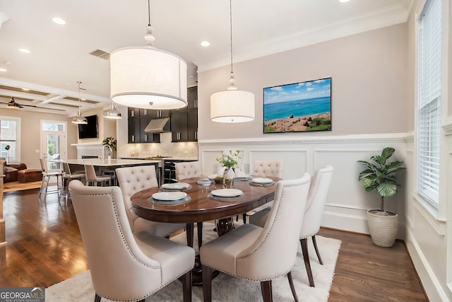 dining area featuring coffered ceiling, dark wood-type flooring, ornamental molding, and beamed ceiling