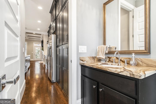 bathroom featuring vanity and hardwood / wood-style floors