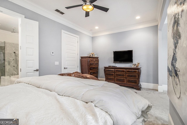 bedroom featuring light carpet, connected bathroom, crown molding, and ceiling fan